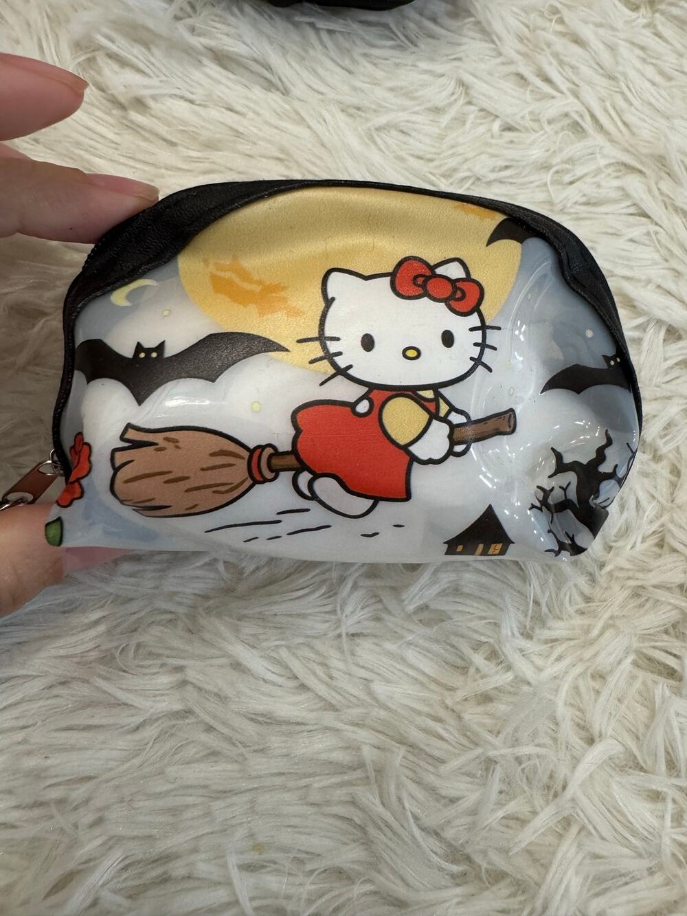 Hello Kitty Halloween Witch coin purse keychain riding a broomstick with bats